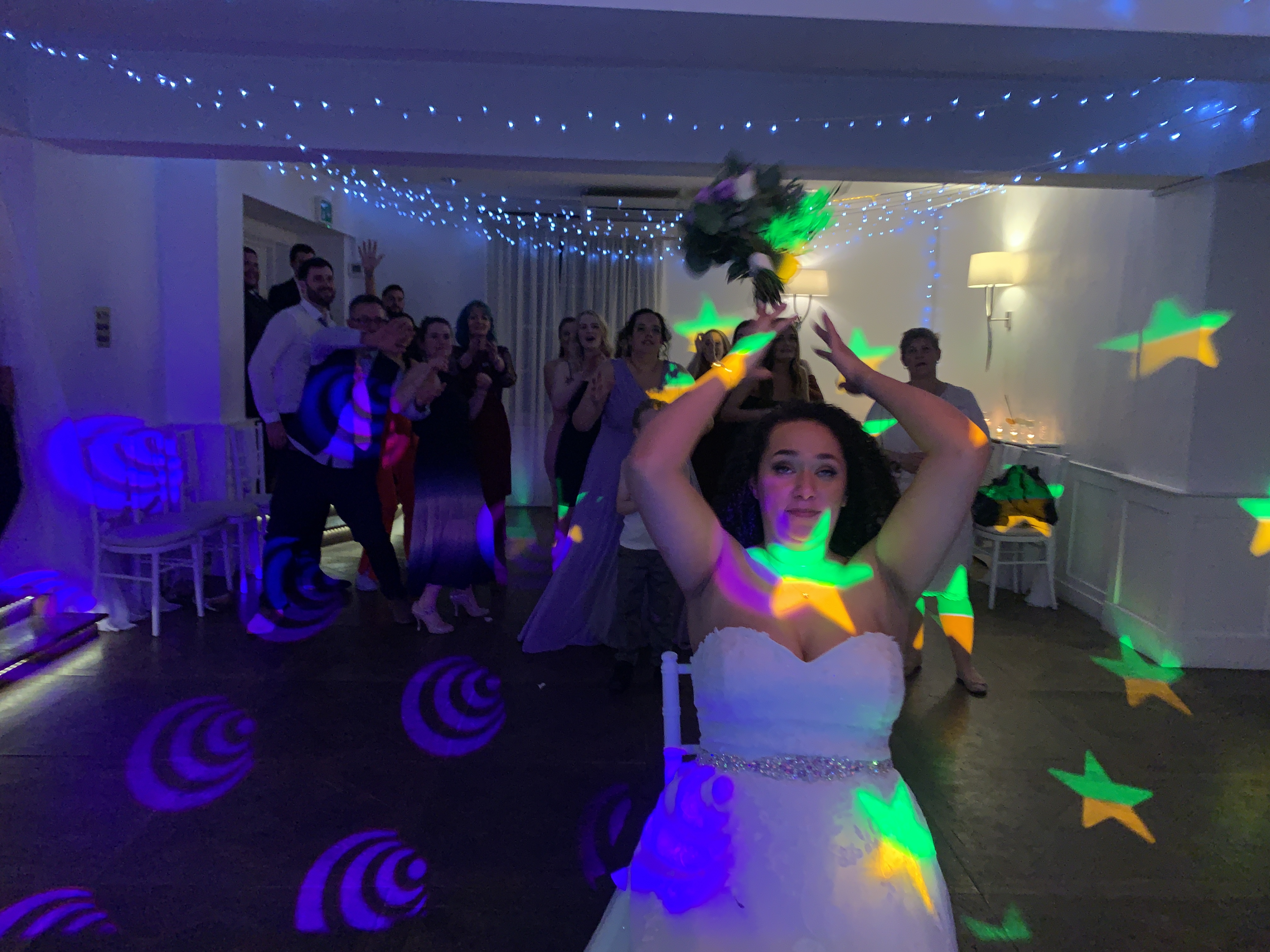 Chichester Harbour wedding venue. Bride throwing the bouquet